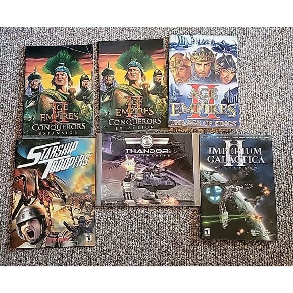 Lot of 6 Age of Empires, Starship Troopers, Galactica Soft Back Guide Books - Picture 1 of 4